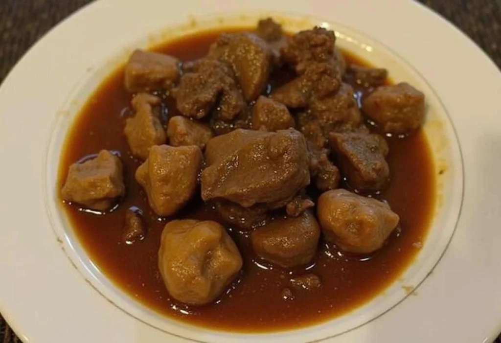 Hearty beef cheek stew with tender meat, vegetables, and rich broth.